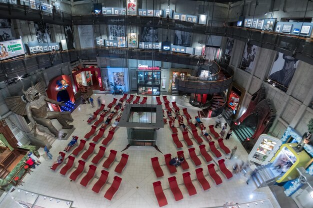 A wide shot of a large eSports conference or expo in Brazil, filled with attendees, booths showcasing gaming products, and activities taking place. The image reflects the growth and commercialization of the eSports industry, drawing in crowds, and highlighting the excitement that eSports offers.