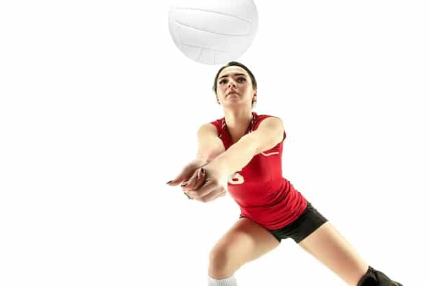An action shot of a volleyball player spiking the ball during a Superliga match in Brazil, showing the intensity and skill of the game. Focus on the player's power and the reactions of the opposing team.