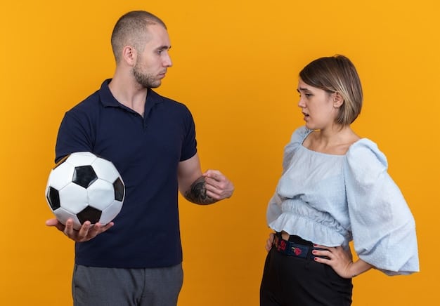 A frustrated soccer player arguing with the referee after a VAR decision went against his team, highlighting the controversies and emotional reactions often associated with VAR.