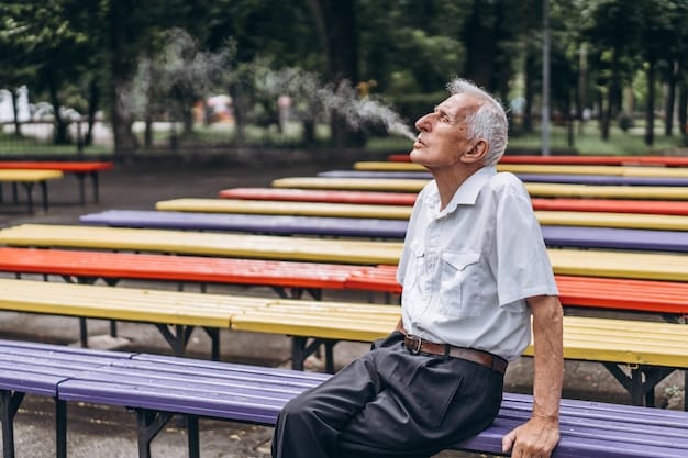 An elderly man is sitting on a park bench, clearly struggling to breathe, highlighting the effects of air pollution on older people.