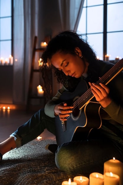 A person practicing a musical instrument (like a guitar or piano) with a peaceful expression, showcasing the active engagement with music and its therapeutic benefits.