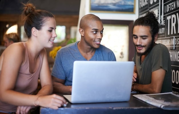 A group of diverse Brazilian workers attending an AI training workshop, using laptops and interacting with instructors, set against the backdrop of a modern co-working space.