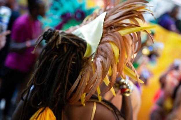 A lively street carnival in Salvador, Bahia, showcasing colorful costumes, energetic dancers, and a vibrant musical performance. Capture the festive atmosphere and the cultural richness of the event.