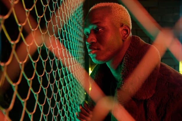 A close-up shot of a Brazilian eSports player during a high-stakes match, showing intense focus and determination. The player is wearing a team jersey and headphones, with the game screen reflected in their glasses.